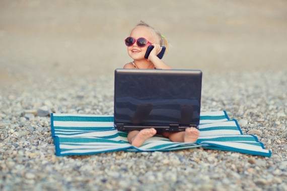 girl on the phone with laptop