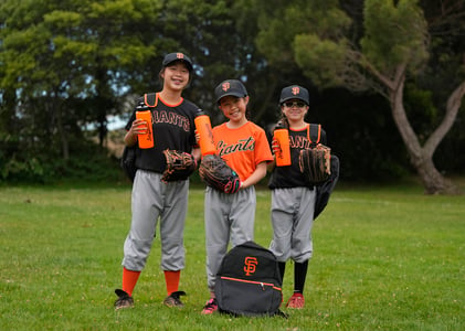 Three Young Baseball Players in Giants Jerseys