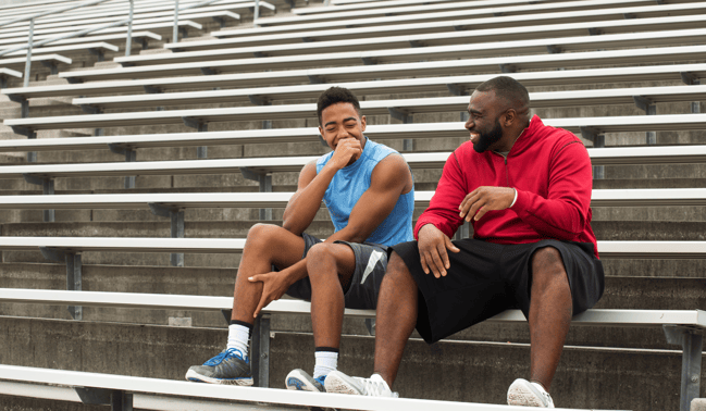 Mentor and student laughing together