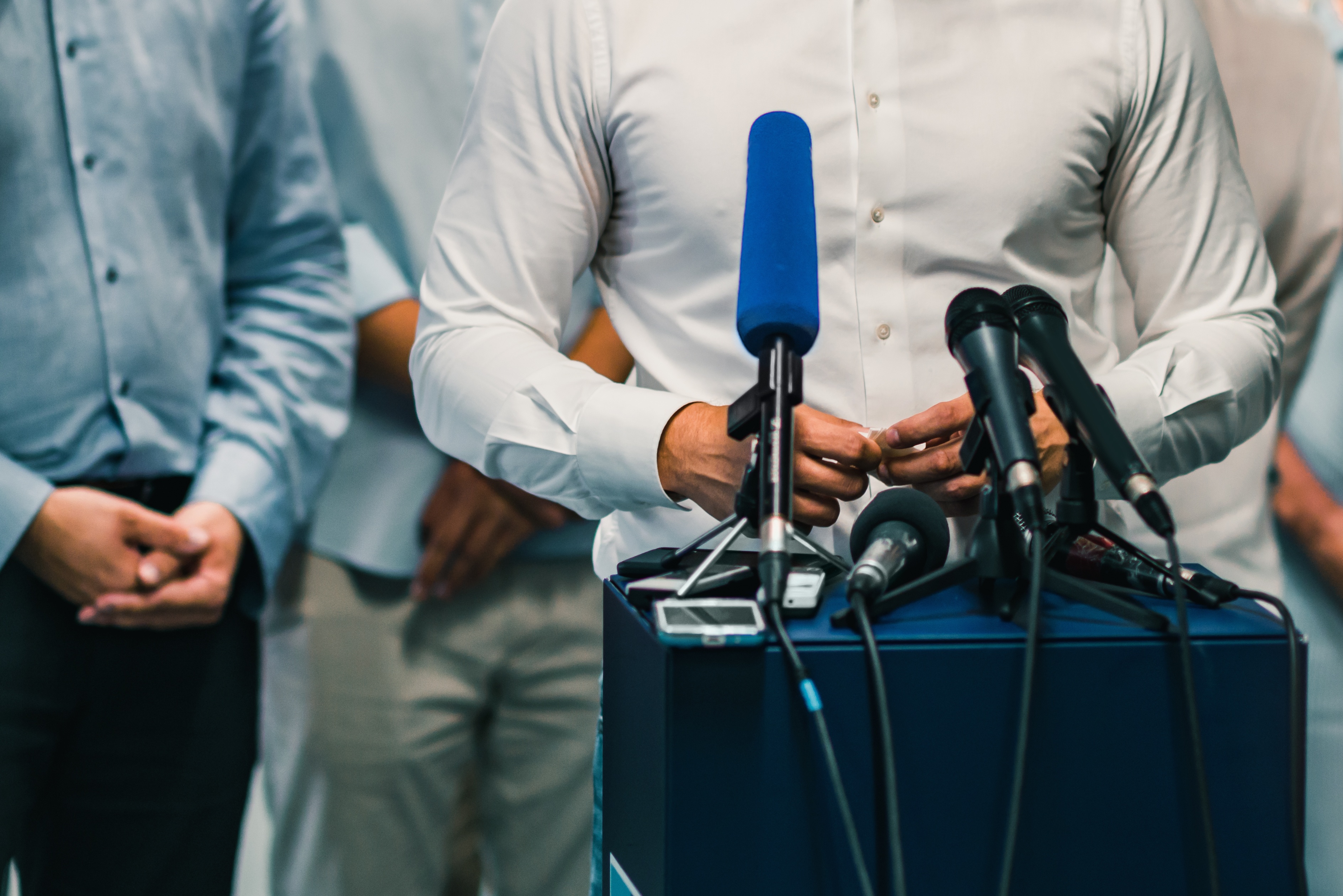 businessman-during-press-conference-PTSUW5K