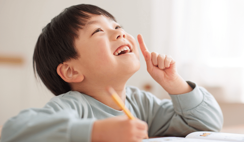 Happy Child doing homework 