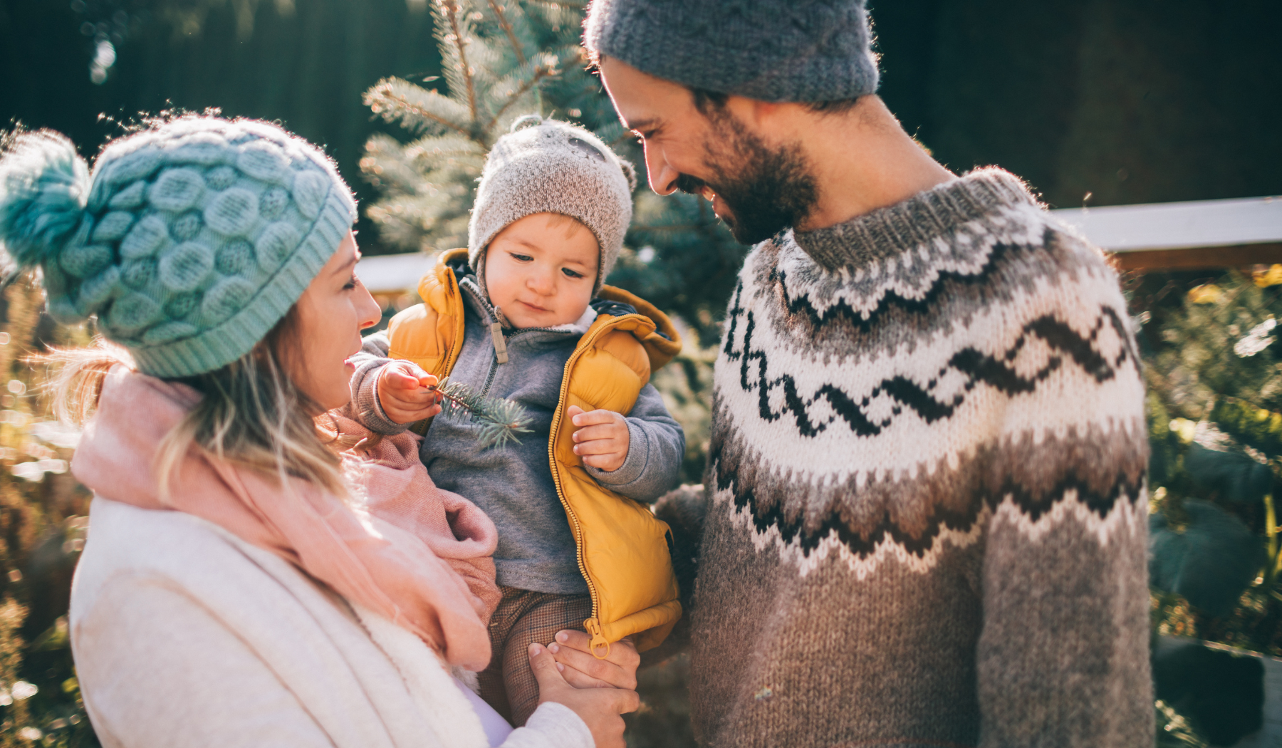 Family together looking at trees in winter