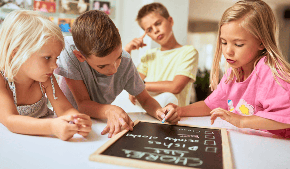 Children making a chores checklist