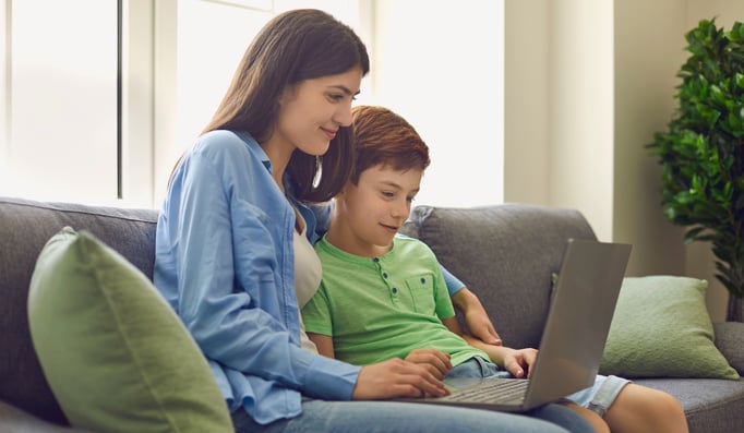 mom and son using a computer